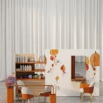 Pannello divisorio decorato Agora che separa la zona lettura dal soggiorno di una casa di riposo